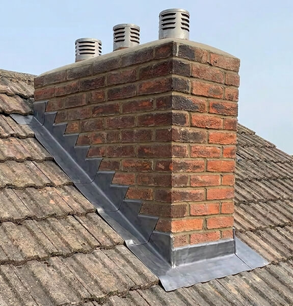 Chimney repair and flashing work on a roof in Hastings